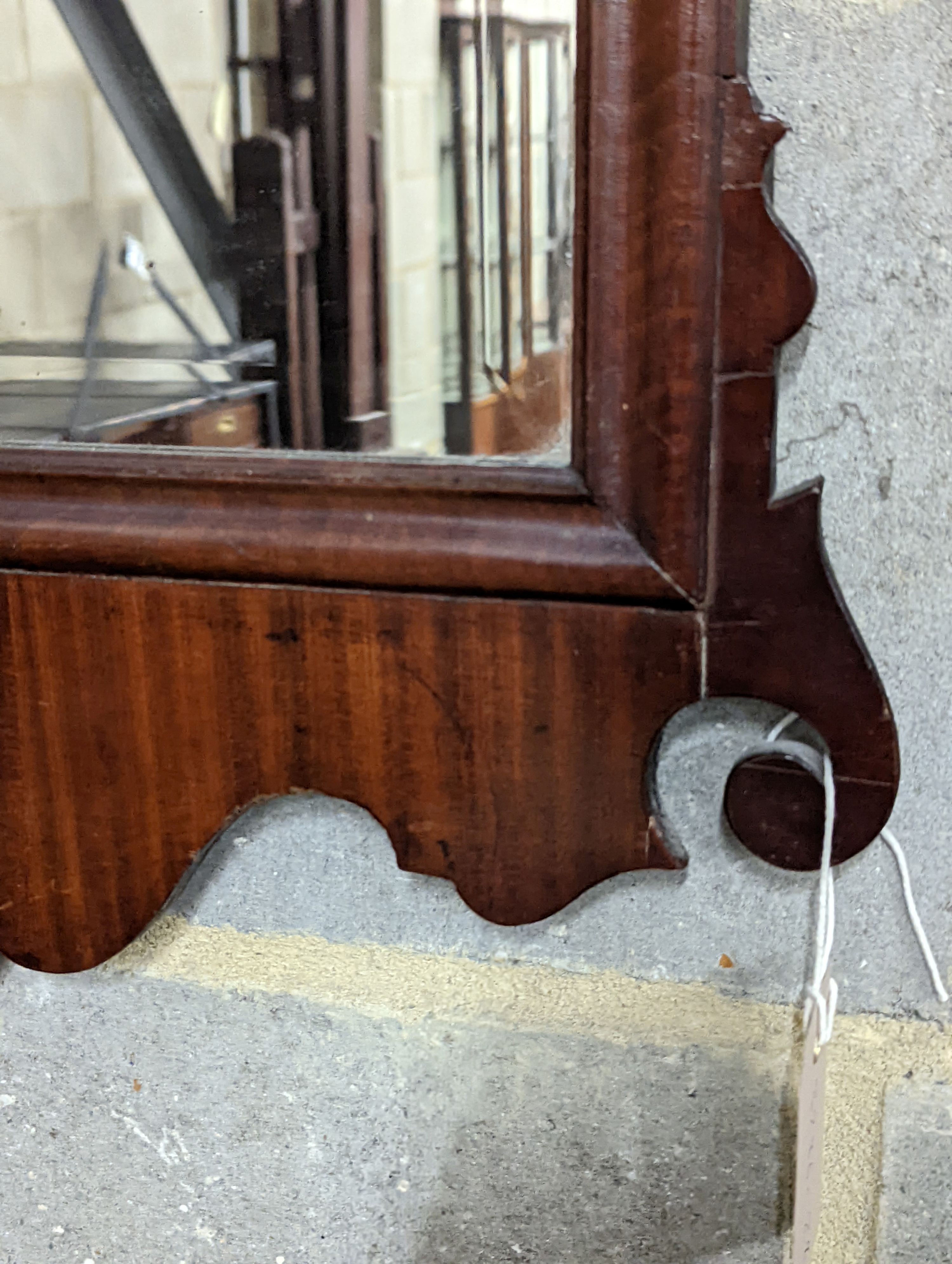 A George II style Fret cut mahogany wall mirror. Length - 86cm, Width - 48cm.